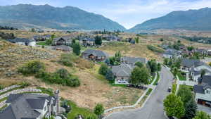 Aerial view of residential area featuring a mountain backdrop