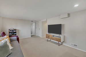 Living room featuring carpet floors and recessed lighting