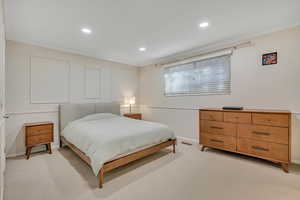 Bedroom featuring ornamental molding, light carpet, and recessed lighting