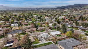Aerial perspective of suburban area featuring a mountainous background