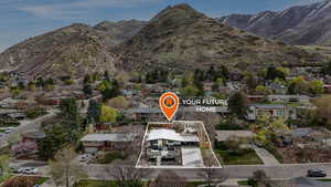 Aerial view of residential area featuring mountains