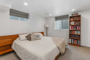 Carpeted bedroom featuring recessed lighting