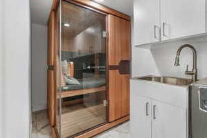 Relaxing sauna with marble look tiles