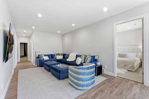 Living room with wood finish floors and recessed lighting