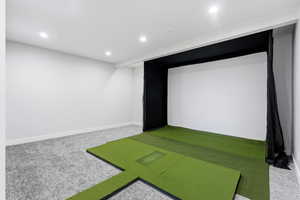 Rec room with golf simulator, carpet flooring, and recessed lighting