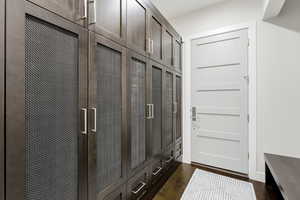 Mudroom featuring dark wood finished floors
