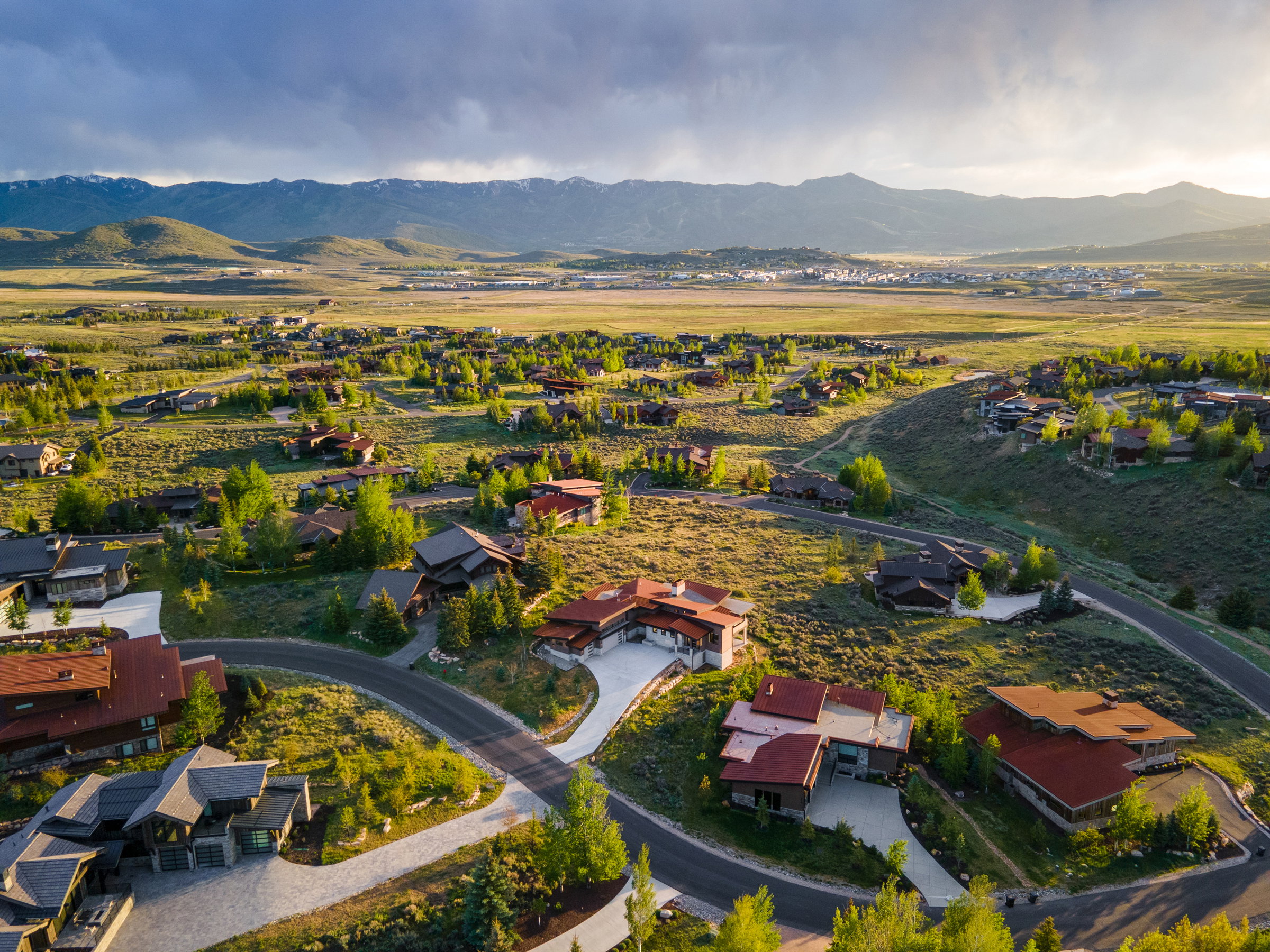 Expansive residential area featuring contemporary architecture and undulating terrain
