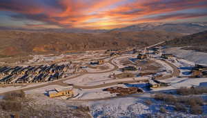 Aerial view at dusk of a residential view and a mountain view