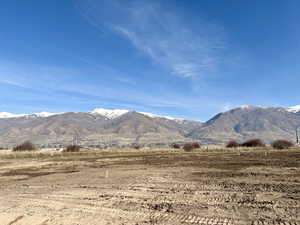 View of mountain backdrop featuring rural landscape