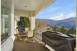 View of patio featuring a mountain view and a grill