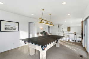 Rec room with carpet floors and recessed lighting