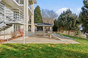 View of swimming pool while featuring a yard and a patio area