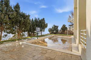 View of swimming pool patio/ terrace