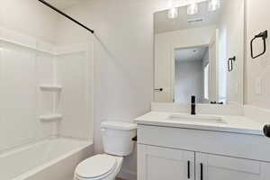 Full bathroom featuring vanity and shower / tub combination