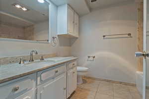 Bathroom featuring vanity and light tile patterned flooring