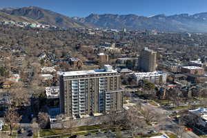 Aerial view of property's location with a mountain backdrop and nearby urban area