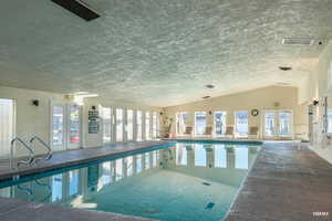 Large indoor community pool area complete with bathrooms, showers changing rooms.
