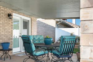 View of covered patio with outdoor dining area