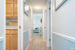 Hall featuring tile flooring