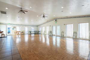 Community events room featuring a dance floor, French doors, recessed lighting, high vaulted ceiling, and ceiling fans.