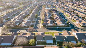 Aerial overview looking above the property's location down into the community towards the clubhouse, not far from shopping and the regional medical center.