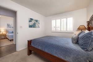 Bedroom with carpet flooring and baseboards