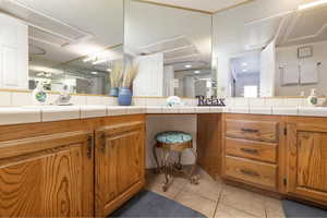 Bathroom featuring vanity and light tile patterned floors