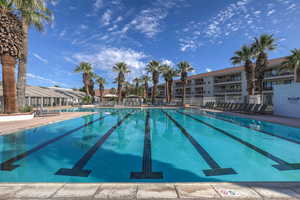 Community pool featuring a patio