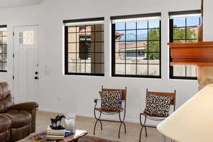 Living area with light tile patterned floors and a mountain view