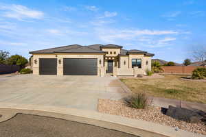 Prairie-style home with stucco siding, a garage, concrete driveway, stone siding, and a tile roof
