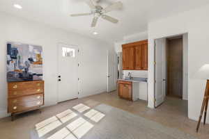Bedroom with a ceiling fan and light tile patterned floors