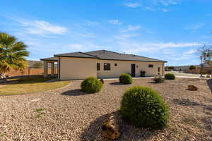 Back of house featuring stucco siding and a patio area