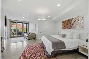 Bedroom featuring access to exterior, recessed lighting, and light tile patterned floors