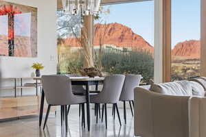 Dining area with a mountain view and a chandelier