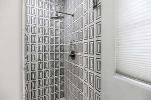 Bathroom with a tile shower