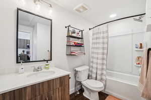 Full bath with vanity, shower / bath combination with curtain, and recessed lighting