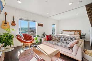 Bedroom with wood finished floors, recessed lighting, and a mountain view
