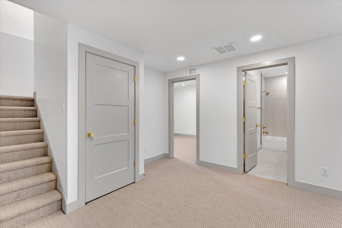 Carpeted living area featuring recessed lighting