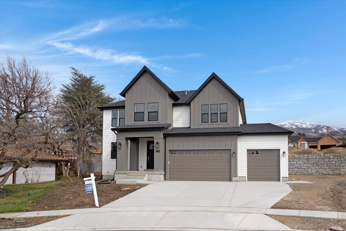 Modern two-story residence featuring a striking combination of vertical siding and horizontal lap siding
