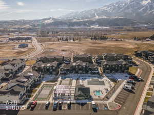 Aerial perspective of suburban area with a mountainous background