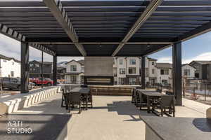 View of patio featuring a residential view and outdoor dining space