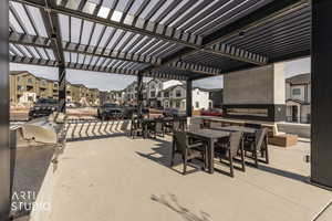 View of patio / terrace featuring outdoor dining area and a residential view