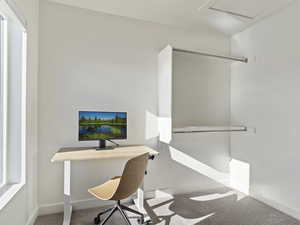Office area with carpet floors and baseboards