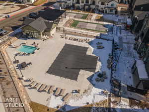 Aerial perspective of suburban area with a pool area