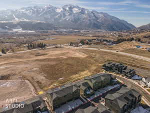 Aerial view of residential area featuring a mountainous background