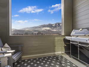 Balcony with grilling area and a mountain view