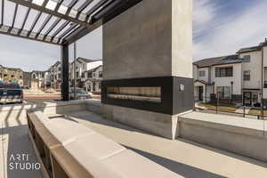 View of patio with a residential view and a pergola