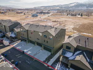 Aerial perspective of suburban area with a mountain backdrop