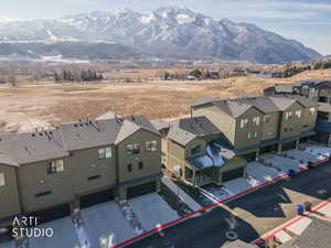 Aerial perspective of suburban area featuring a mountain backdrop