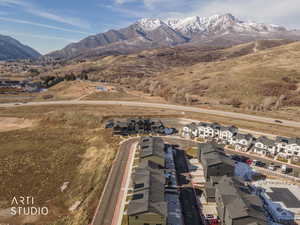 Aerial view of residential area featuring a mountainous background